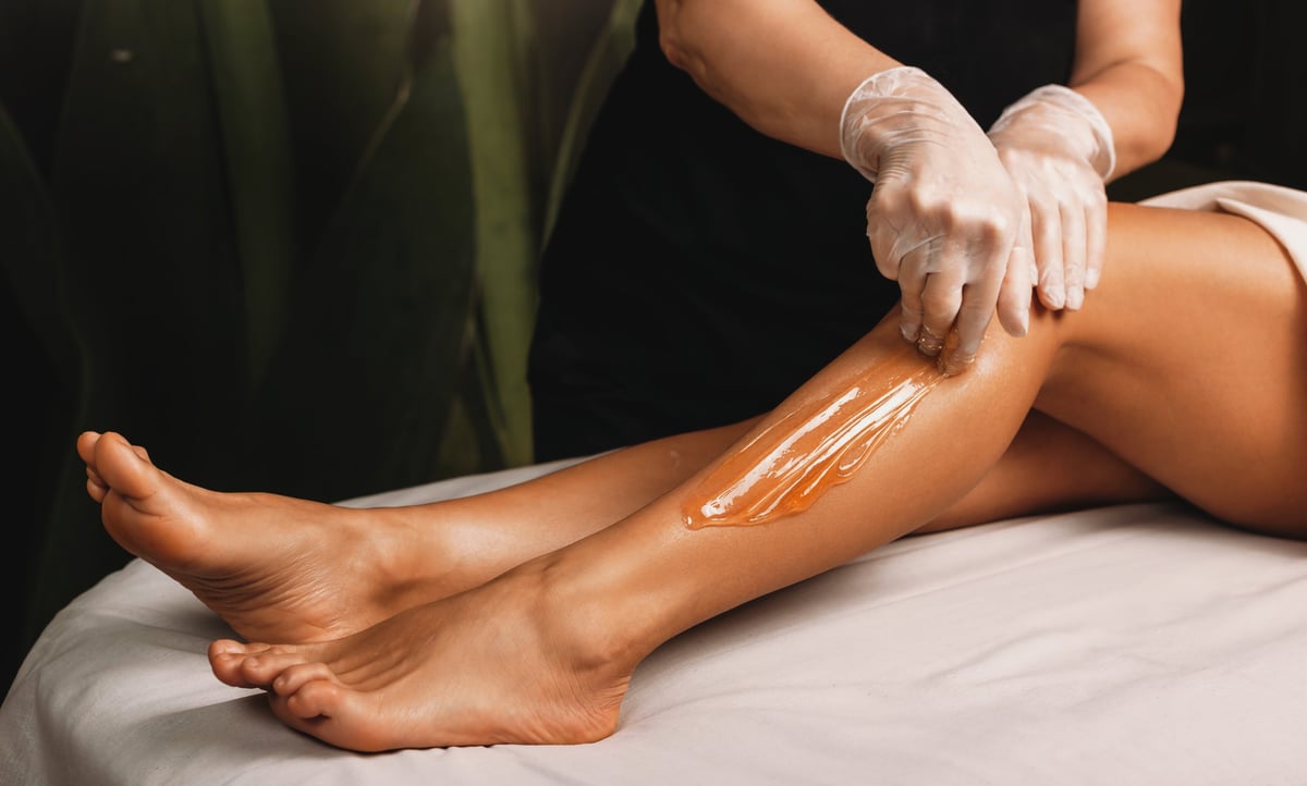 Young girl having epilation procedures at spa salon